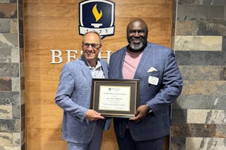 Bethel President Ross Allen congratulates pastor Edrin Williams S’11, who won Bethel Seminary’s second annual Preaching Excellence award.