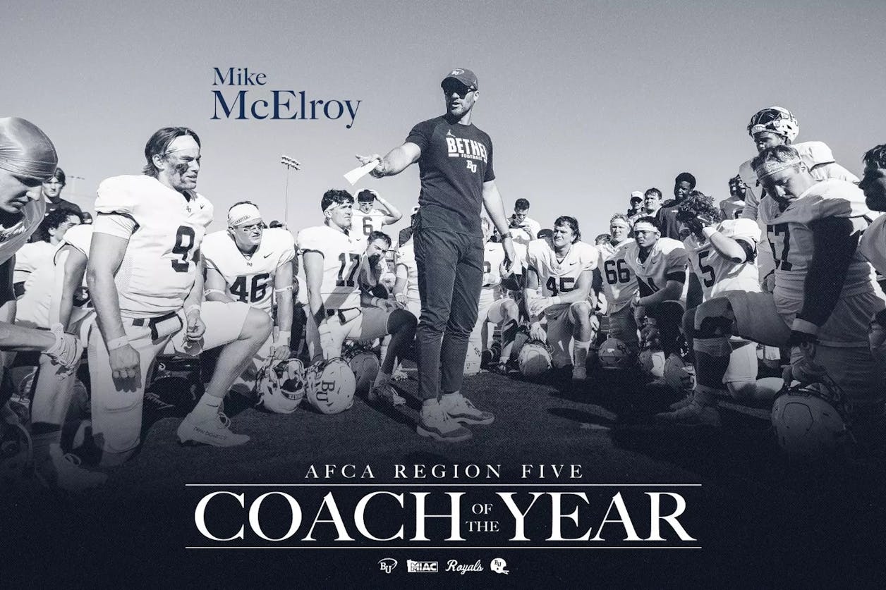 Bethel University head football coach Mike McElroy addresses his team during a postgame huddle after being named AFCA Region Five Coach of the Year.
