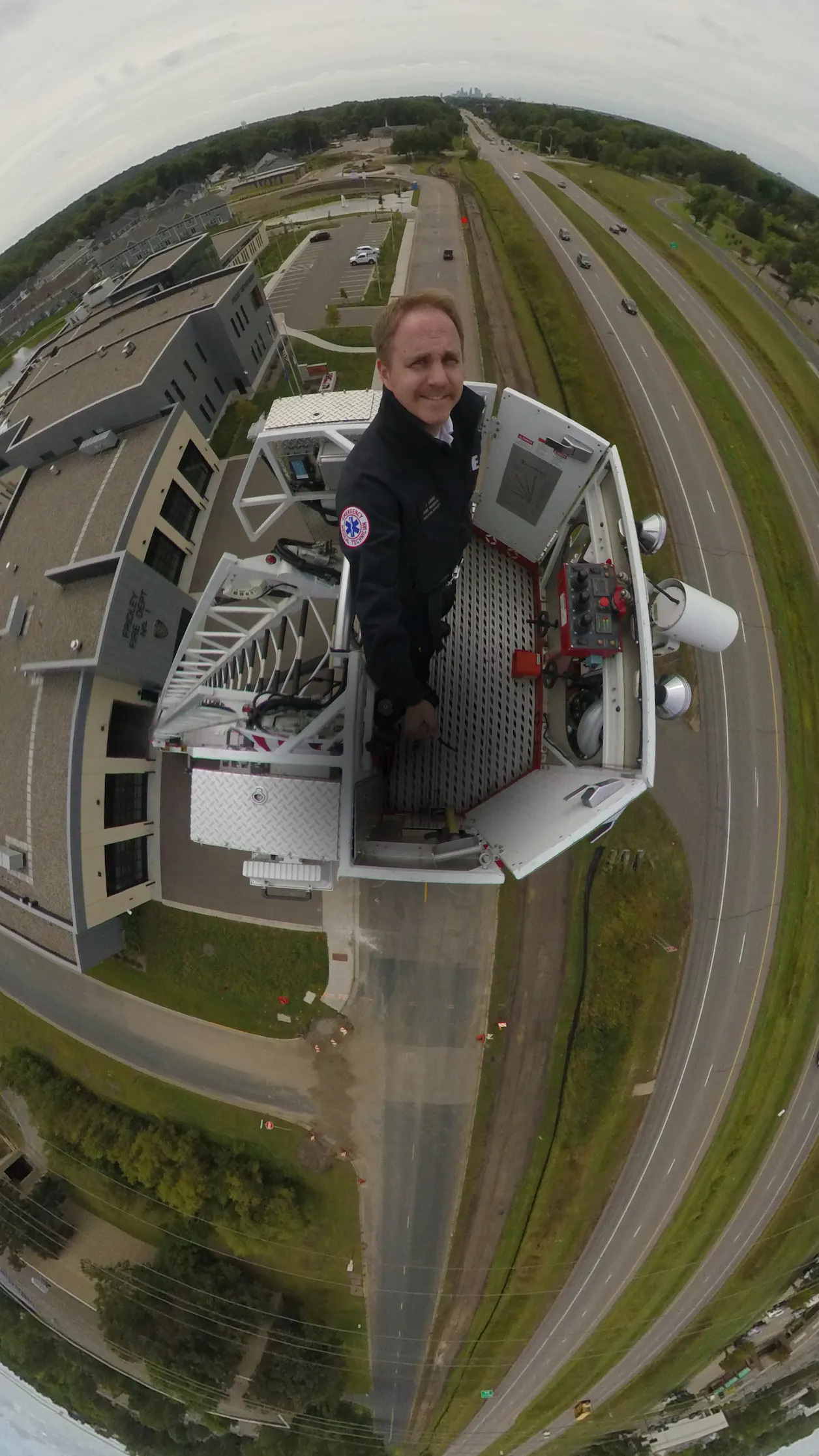 James Lange GS'15 in an aerial platform truck during firefighter training outside Fridley’s civic campus.