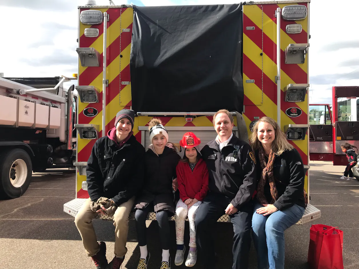 James Lange GS'15 with his family at Fridley Fire Department’s community open house and fire prevention event.