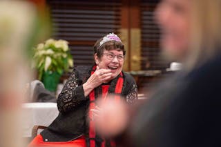 Professor laughs in a tiara