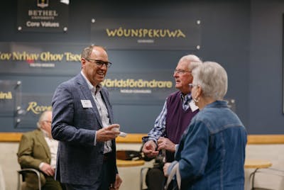 President Ross Allen chats with scholarship donors before dinner at Bethel University