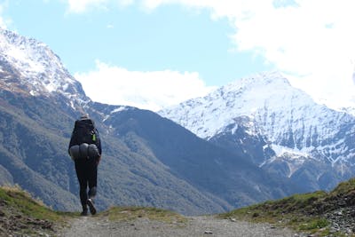 student hiking in mountains