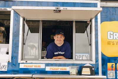 David smiling out the food truck window