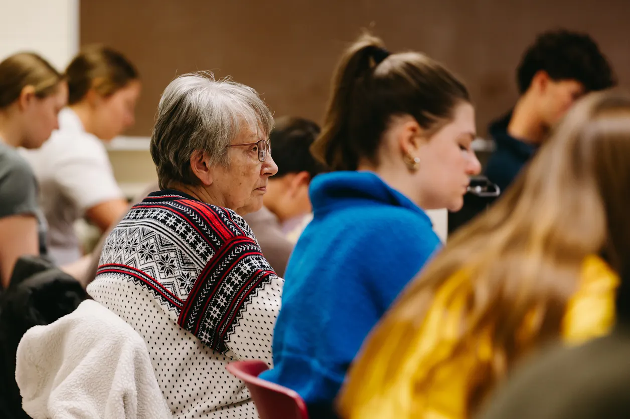 Professor Beilby's mom sits in on one of his class, joining the conversation with undergraduate students. 