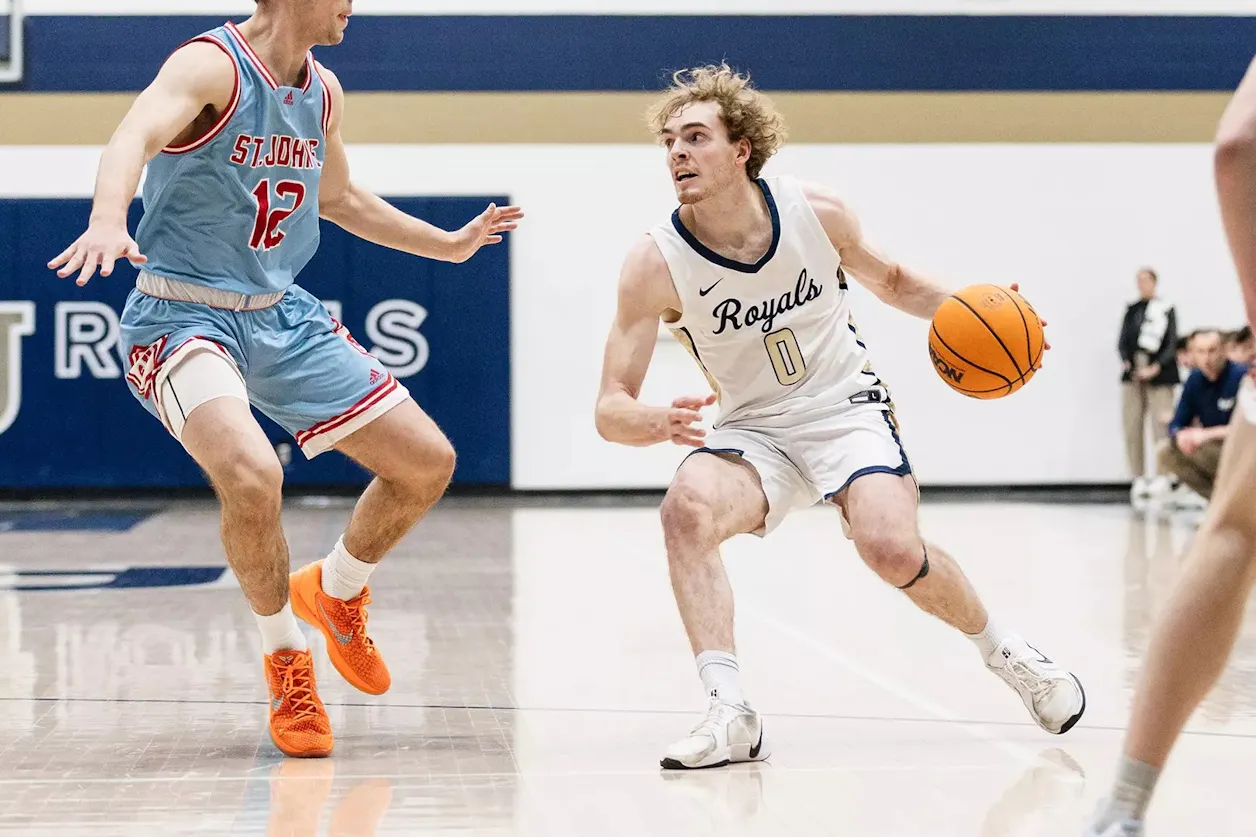 Bethel Royals player drives past defender during game