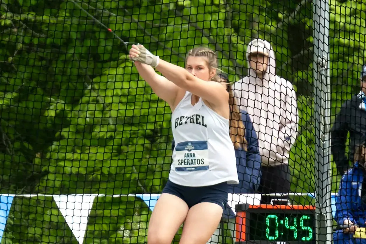 Bethel track athlete Anna Speratos competes in the hammer throw inside the throwing cage.