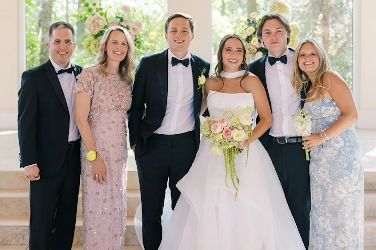 Amanda Kopischke ’96 with her husband, Troy Kopischke ’97, with her three children at a wedding. 