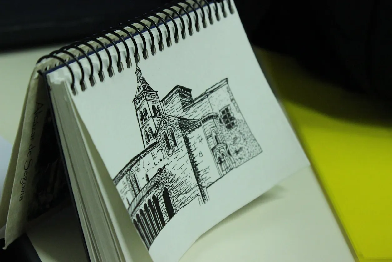 A close up image of a pen drawing of Spanish architecture.