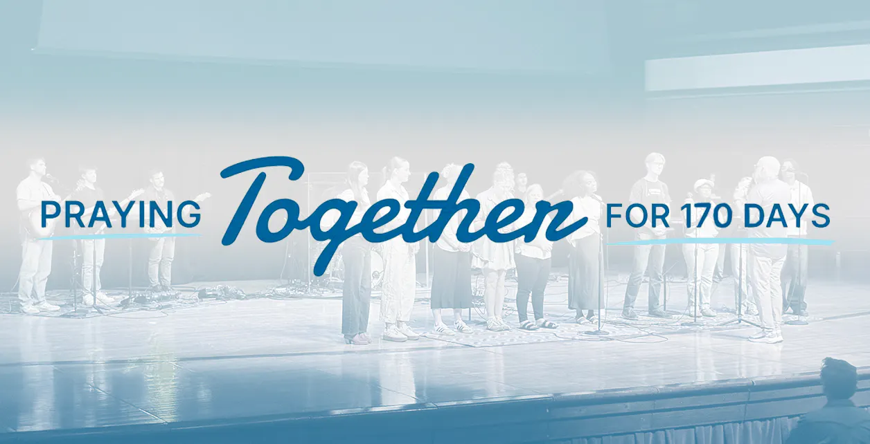 Students on the stage in Benson Great Hall, with "Praying Together" tagline overlaid on the top
