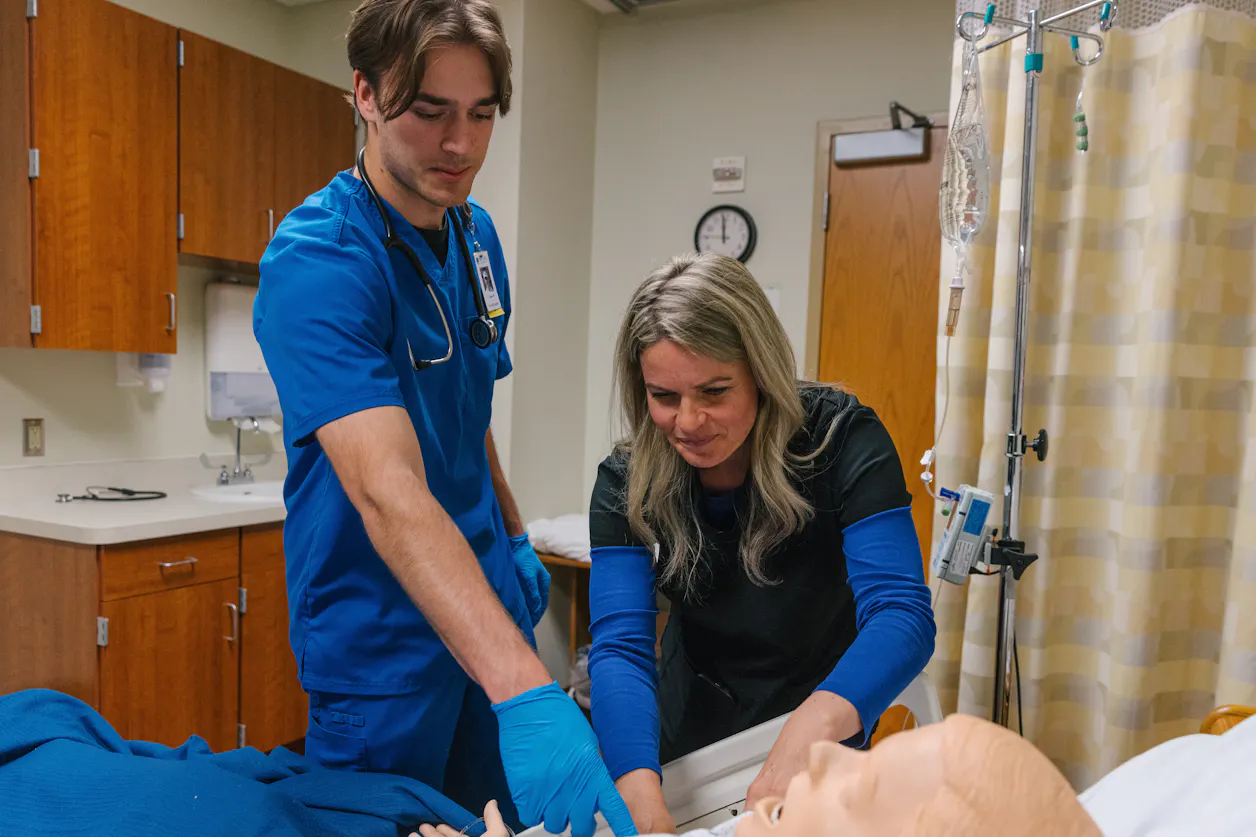 professor and student in nursing working together