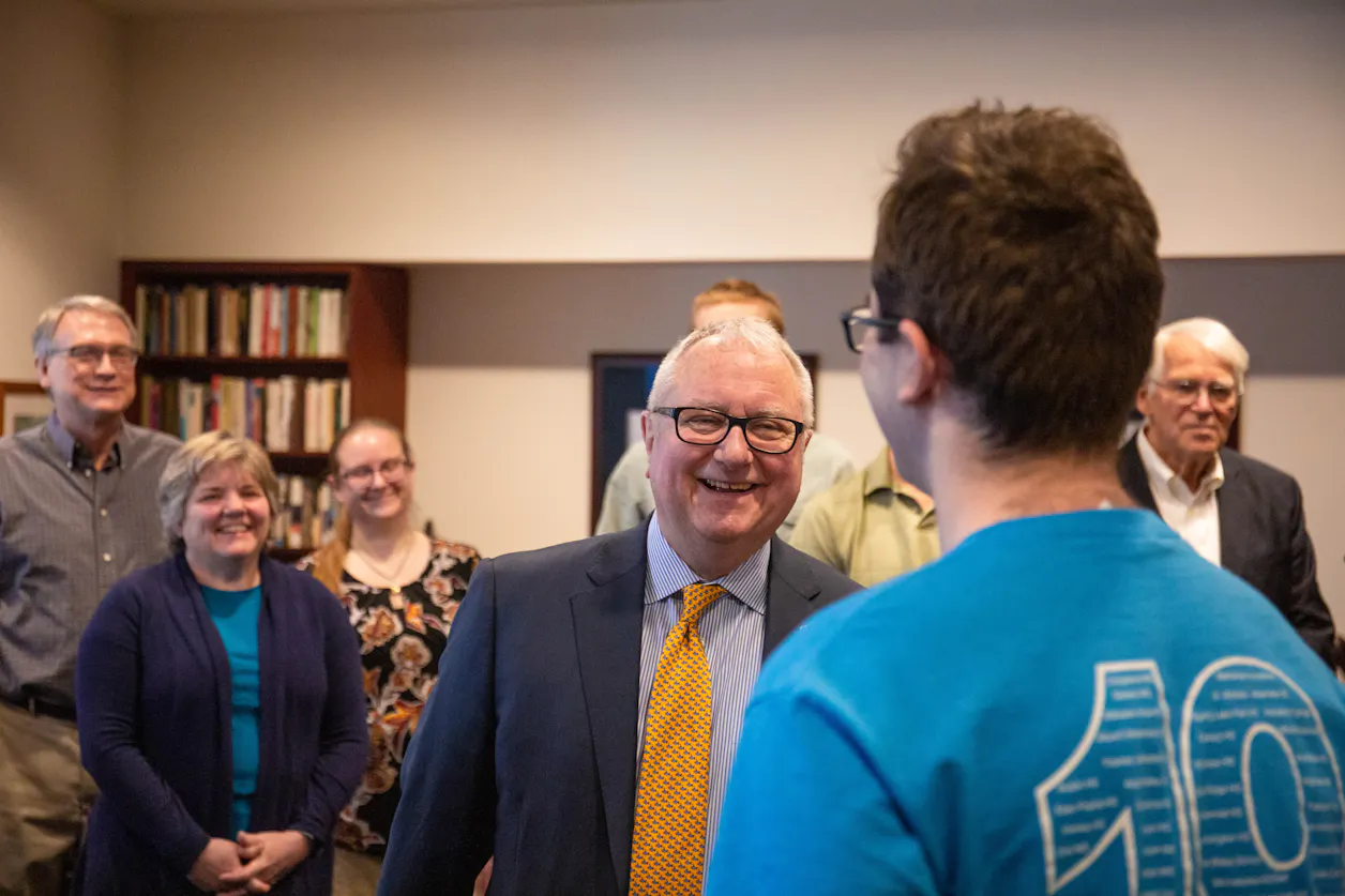 Aaron Coe '19 is surprised with the SCA Glenn T. Seaborg Science Scholarship as physics faculty look on