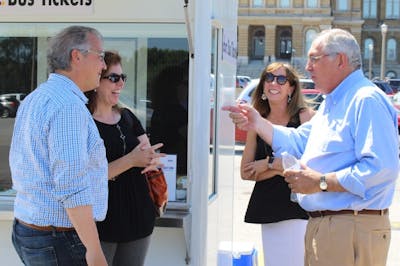 Wanke speaks with former Iowa Congressman David Young and others during DART’s annual Iowa State Fair service.
