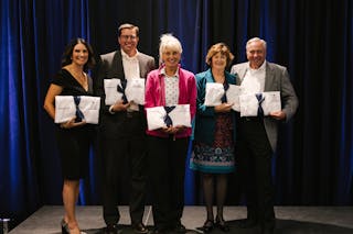 The Anderson family, including Ingrid and Brent '98 Anderson, Julie Edinger '93, GS'22, and Barb GS'01 and Rollie Anderson, were presented with the first official Anderson Family College of Health Sciences medical coats at the launch celebration. 