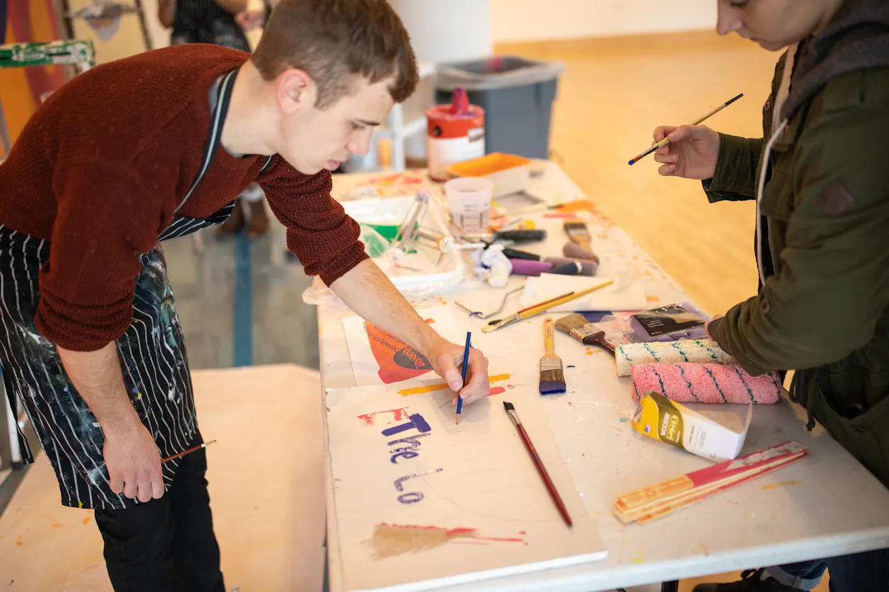 Josh Eller '20 prepares to add to the mural. 