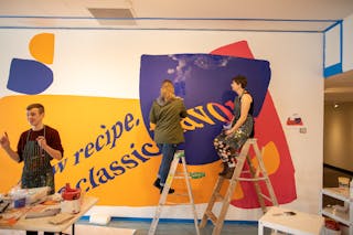 Students in Professor of Art Amanda Hamilton's advanced painting class complete a mural in response to Kent's work.