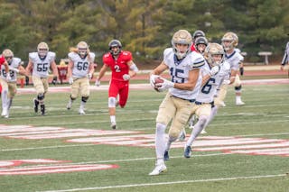 Bethel’s Jon Pytlak ’20 turns downfield after catching what would end as a 72-yard touchdown in the second quarter of the Royals 27-24 win against North Central College in Naperville, Illinois, on November 24.