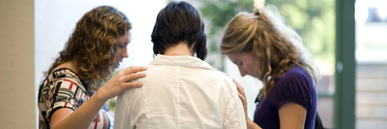 Seminary students praying