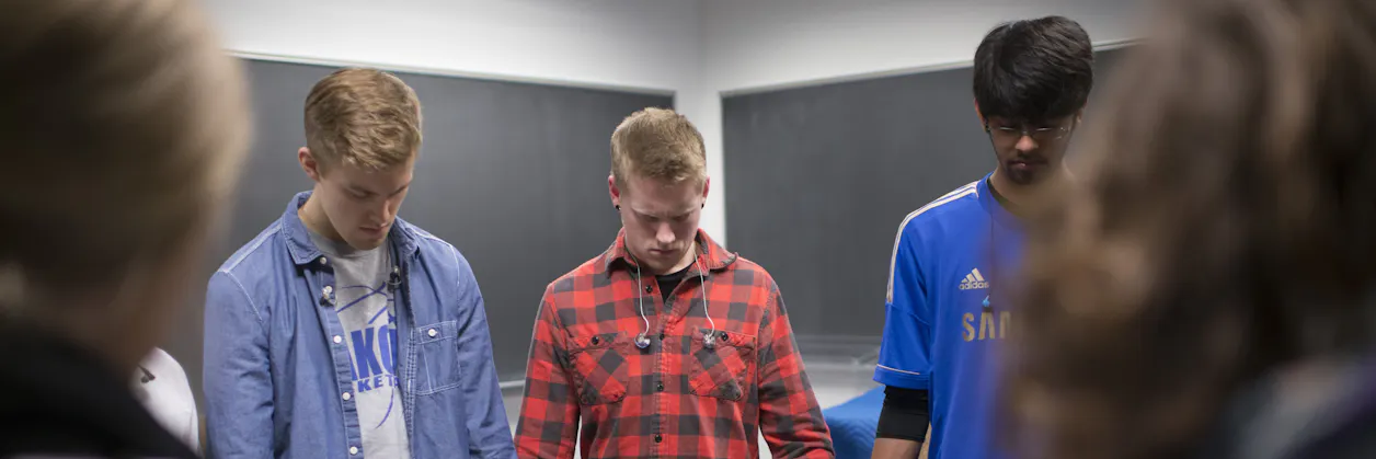 Undergraduate students praying