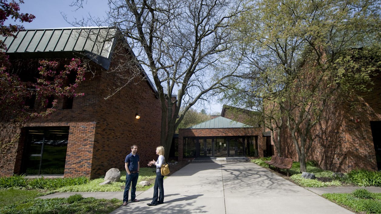 Students chatting outside the Seminary building.