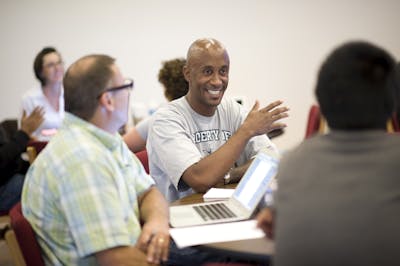 Image of residency students working together in class.