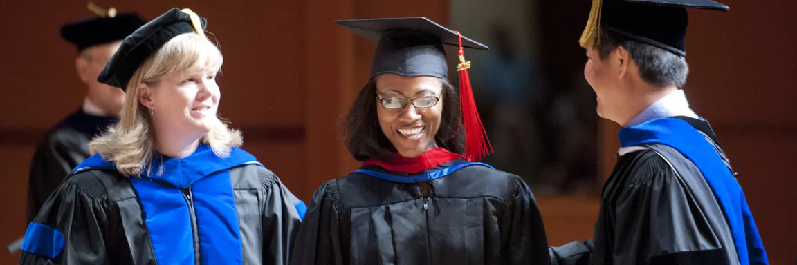 Student smiles during graduation ceremony