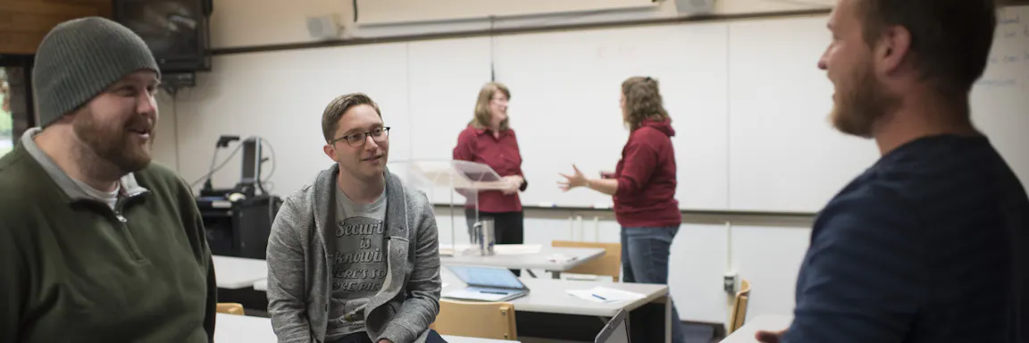 Seminary students hanging out in a classroom