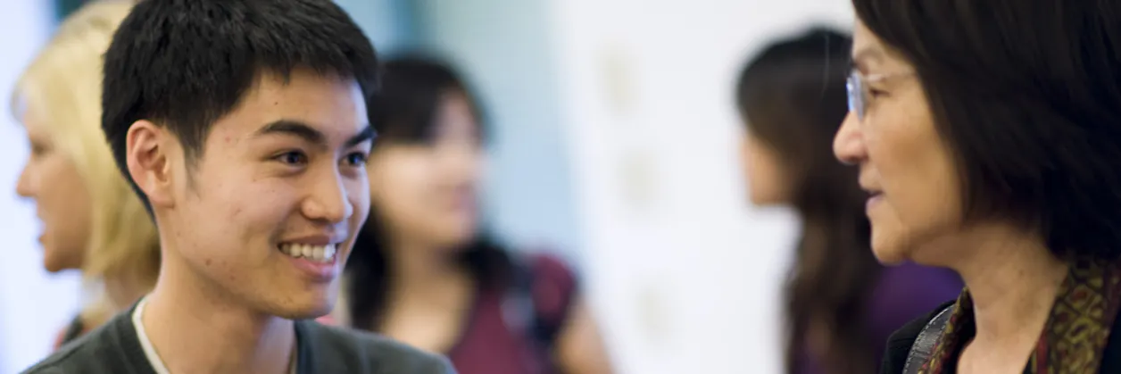 Seminary students talking together in a hallway