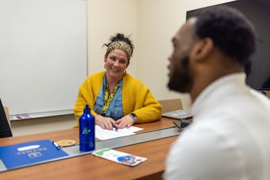 Woman smiling in classroom