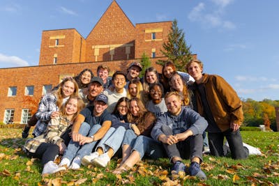 Group of 17 students on the lawn by the CLC