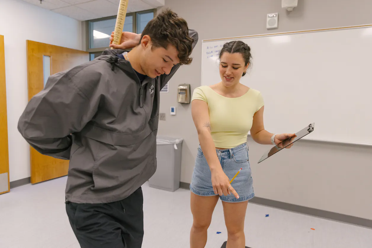 Students applying exercise science skills in a practical setting. 