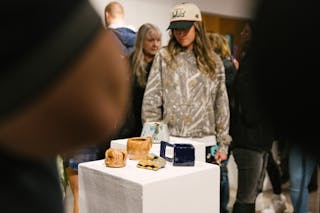 Ceramic artworks displayed on pedestals in an art gallery. 