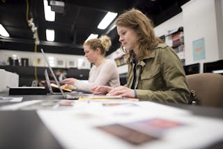 Students work in the graphic design lab at Bethel University