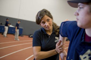 Athletic Training student helping an athlete.
