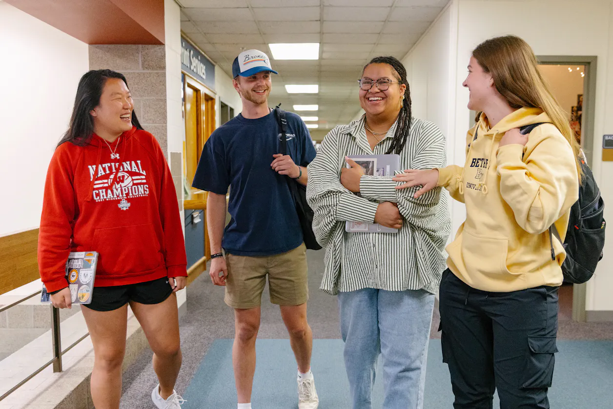 students walking and conversing 