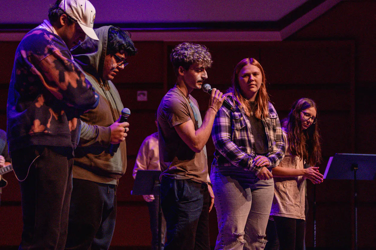 student leading in prayer