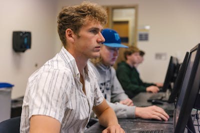 Students focused on their work in a computer lab.