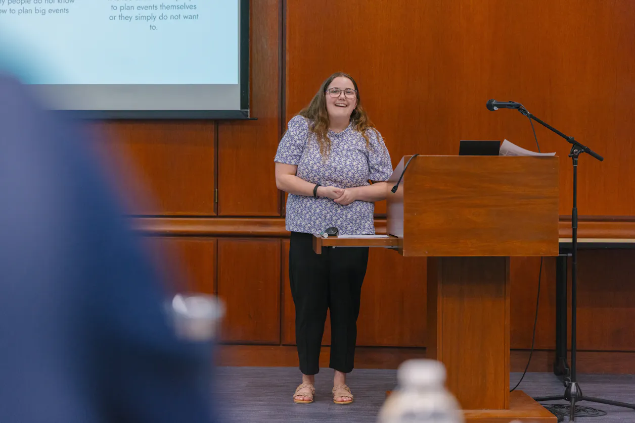 Student presenting in a classroom, engaging the audience with a presentation.