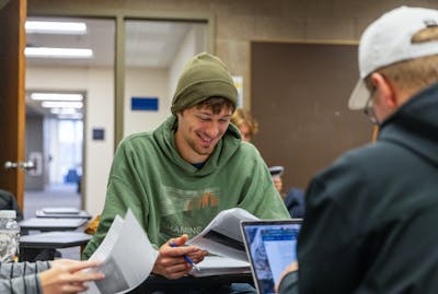 Students working together at a table.