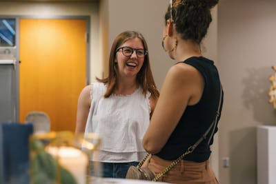 Two Bethel students engaged in a lively and friendly discussion.