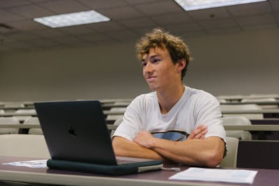 Bethel University students sitting attentively in a classroom, engaged in a lecture.