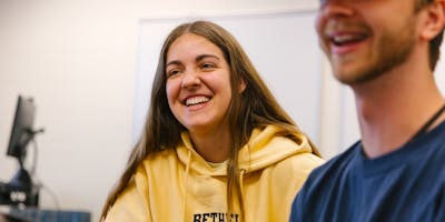 Female student laughs at Bethel University