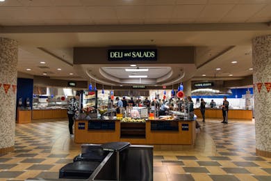 Students and staff move through food stations inside Bethel’s campus dining center.