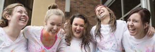 Students laughing together after an event