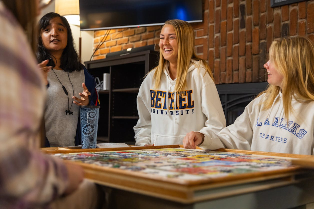 Girls doing a puzzle in Arden Village