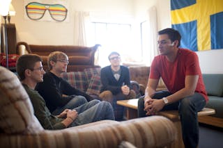Bethel students talk in their dorm room