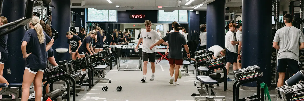 Students work out together in Bethel’s fitness center during a group training session.