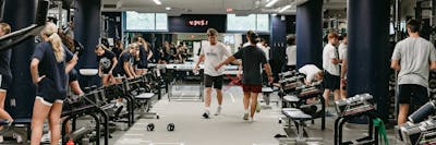 Students work out together in Bethel’s fitness center during a group training session.