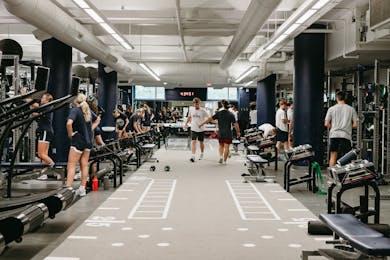 Students work out together in Bethel’s fitness center during a group training session. 